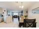 An eat-in kitchen area features a view of the dining and living areas at 8517 N Branch Ave, Tampa, FL 33604