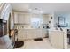 A well-lit kitchen featuring modern appliances, light gray cabinets, and tiled flooring at 8517 N Branch Ave, Tampa, FL 33604