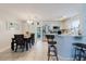 An eat-in kitchen area features modern appliances, white cabinets, and counter seating at 8517 N Branch Ave, Tampa, FL 33604