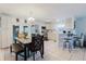 An eat-in kitchen area features modern appliances, white cabinets, and a dining area at 8517 N Branch Ave, Tampa, FL 33604