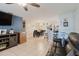 An open concept living room featuring a dining area and kitchen, and tile flooring throughout the house at 8517 N Branch Ave, Tampa, FL 33604