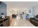 Bright, open floor plan connects living, dining, and kitchen areas, with tile flooring throughout at 8517 N Branch Ave, Tampa, FL 33604