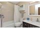 Bathroom features neutral tile, a shower-tub combo, modern vanity, and updated fixtures at 9465 126Th Ave, Largo, FL 33773