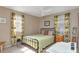 Bedroom features large windows, ceiling fan, and coordinating furnishings at 9465 126Th Ave, Largo, FL 33773