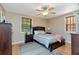 Bedroom features ceiling fan, wood blinds, and coordinating furnishings at 9465 126Th Ave, Largo, FL 33773