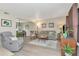 Bright and inviting living room with wood floors and an open concept design to dining area at 9465 126Th Ave, Largo, FL 33773