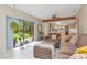 Inviting living area with large sliding glass doors to the backyard and an open flow to the kitchen at 9465 126Th Ave, Largo, FL 33773