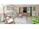 Cozy living room with wood floors, neutral colors, and large windows providing natural light at 9465 126Th Ave, Largo, FL 33773