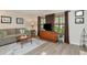 Cozy living room with wood floors, neutral colors, and large windows providing natural light at 9465 126Th Ave, Largo, FL 33773