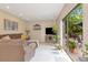 Bright living room with a sliding glass door leading to the patio, offering an inviting space at 9465 126Th Ave, Largo, FL 33773