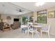 Cozy living space with tile floors, comfortable seating, and seamless transition to the outdoor patio at 9465 126Th Ave, Largo, FL 33773