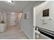 Inviting home foyer leads to a convenient half bathroom and an elegant living area at 9720 Hound Chase Dr, Gibsonton, FL 33534
