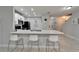 Modern kitchen with stainless steel appliances, a breakfast bar, and ample counter space at 9720 Hound Chase Dr, Gibsonton, FL 33534