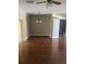 Cozy dining area featuring hardwood floors, an elegant chandelier and access to the patio at 9833 Hound Chase Dr, Gibsonton, FL 33534
