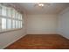 Bedroom with laminate floors, ceiling fan, large window, and closet at 1009 Andover Cir, Sun City Center, FL 33573