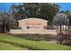 Welcoming Sun City Center Minto community entrance with lush landscaping and serene water feature at 1009 Andover Cir, Sun City Center, FL 33573