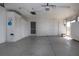Spacious garage with room for parking and storage, and featuring built in storage cabinets at 1009 Andover Cir, Sun City Center, FL 33573