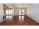 Open living room with wood floors, and access to the pool at 1009 Andover Cir, Sun City Center, FL 33573