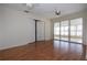 Open-concept room featuring wood floors, bi-fold doors, and screened in porch at 1009 Andover Cir, Sun City Center, FL 33573