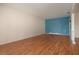 Unfurnished living room, showcasing the blue accent wall and natural light at 1009 Andover Cir, Sun City Center, FL 33573