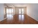 Spacious living room with wood floors and glass doors leading to the outdoor area at 1009 Andover Cir, Sun City Center, FL 33573