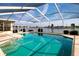 Inviting screened-in pool with views of the tranquil waterfront at 1009 Andover Cir, Sun City Center, FL 33573