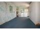 A well lit utility room featuring a washer, dryer and built in storage cabinets at 1009 Andover Cir, Sun City Center, FL 33573