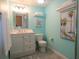 Charming bathroom featuring a single vanity, toilet, and stylish decor creating a spa-like atmosphere at 101 8Th St, Belleair Beach, FL 33786