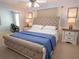 Comfortable bedroom featuring a plush bed, side tables, and a ceiling fan, creating a cozy and inviting space at 101 8Th St, Belleair Beach, FL 33786