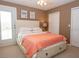 Inviting bedroom with a comfortable bed, closet, and a balcony, perfect for relaxation and enjoying outdoor views at 101 8Th St, Belleair Beach, FL 33786