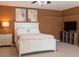 Well-lit bedroom with a modern bed, nightstand, and TV stand, creating a relaxing atmosphere at 101 8Th St, Belleair Beach, FL 33786
