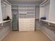 Spacious walk-in closet with built-in shelving and ample storage space for clothing and accessories at 101 8Th St, Belleair Beach, FL 33786