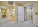 Hallway with elevator entrance, carpet floors, and access to bathroom at 101 8Th St, Belleair Beach, FL 33786