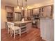 Spacious kitchen featuring granite countertops, stainless steel appliances, and a functional center island for food preparation at 101 8Th St, Belleair Beach, FL 33786