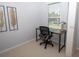 Bright home office with a large window and modern desk, ideal for remote work at 101 8Th St, Belleair Beach, FL 33786