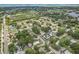 Picturesque aerial view of the neighborhood, near a golf course, showcasing its coastal charm at 1015 13Th Nw Ave, Largo, FL 33770