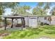 Backyard featuring a gazebo, storage shed, and staircase to the back door at 1015 13Th Nw Ave, Largo, FL 33770