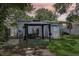 Backyard features a gazebo, storage, landscaping, and easy access to the home's back door at 1015 13Th Nw Ave, Largo, FL 33770