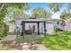 Backyard featuring a gazebo, storage shed, and staircase to the back door at 1015 13Th Nw Ave, Largo, FL 33770