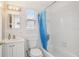 Bright bathroom with shower and bathtub, featuring a window and modern fixtures at 1015 13Th Nw Ave, Largo, FL 33770