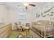 The Bedroom features whimsical decor, a crib, and a playful area rug at 1015 13Th Nw Ave, Largo, FL 33770