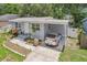 Quaint single-level home with a carport and meticulously landscaped front yard at 1015 13Th Nw Ave, Largo, FL 33770
