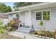 Charming single-story home with an inviting front entrance and well-manicured garden at 1015 13Th Nw Ave, Largo, FL 33770