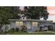 Charming one-story home with well-maintained landscaping and covered front porch, creating a welcoming curb appeal at 1015 13Th Nw Ave, Largo, FL 33770