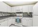 Close-up of a kitchen, highlighting the gas range, microwave, and decorative backsplash at 1015 13Th Nw Ave, Largo, FL 33770