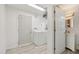 Open laundry room with washer, dryer, and entry door to a bathroom and second exterior door at 1015 13Th Nw Ave, Largo, FL 33770