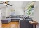 Bright living room featuring hardwood floors, recessed lighting, ceiling fan and large sectional at 1015 13Th Nw Ave, Largo, FL 33770