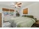 The main bedroom with lots of sunlight, a ceiling fan, and a cat tree at 1015 13Th Nw Ave, Largo, FL 33770
