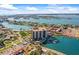 Beautiful aerial shot of a waterfront condo community with boat docks and resort-style amenities at 10355 Paradise Blvd # 1003, Treasure Island, FL 33706