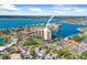 A waterfront condominium building showcasing stunning views and proximity to the water at 10355 Paradise Blvd # 1003, Treasure Island, FL 33706